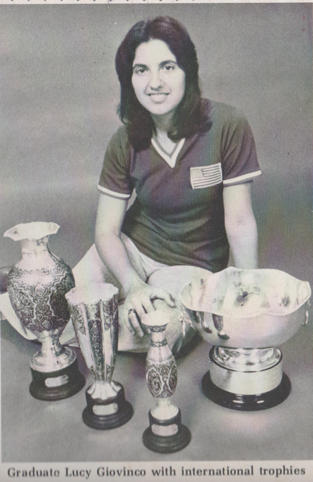 Lucy with trophies and World Cup.jpeg